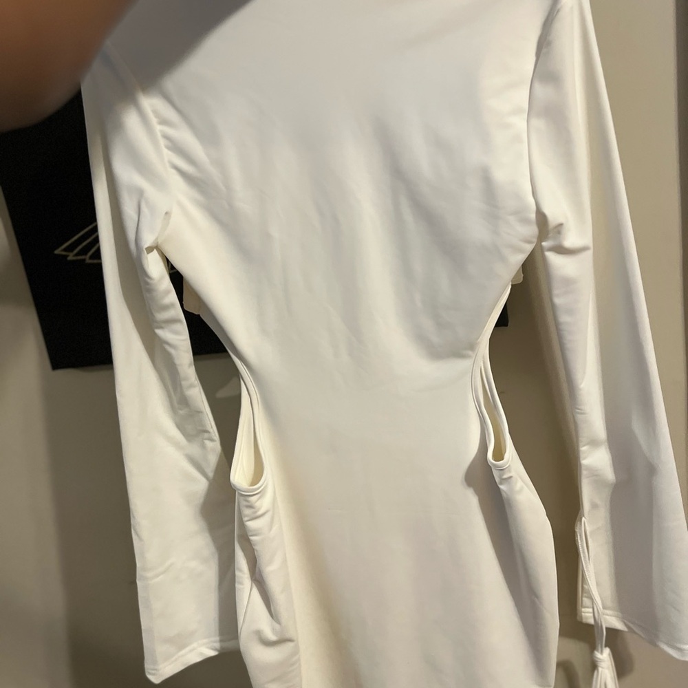 Trendy white dress with side cut outs